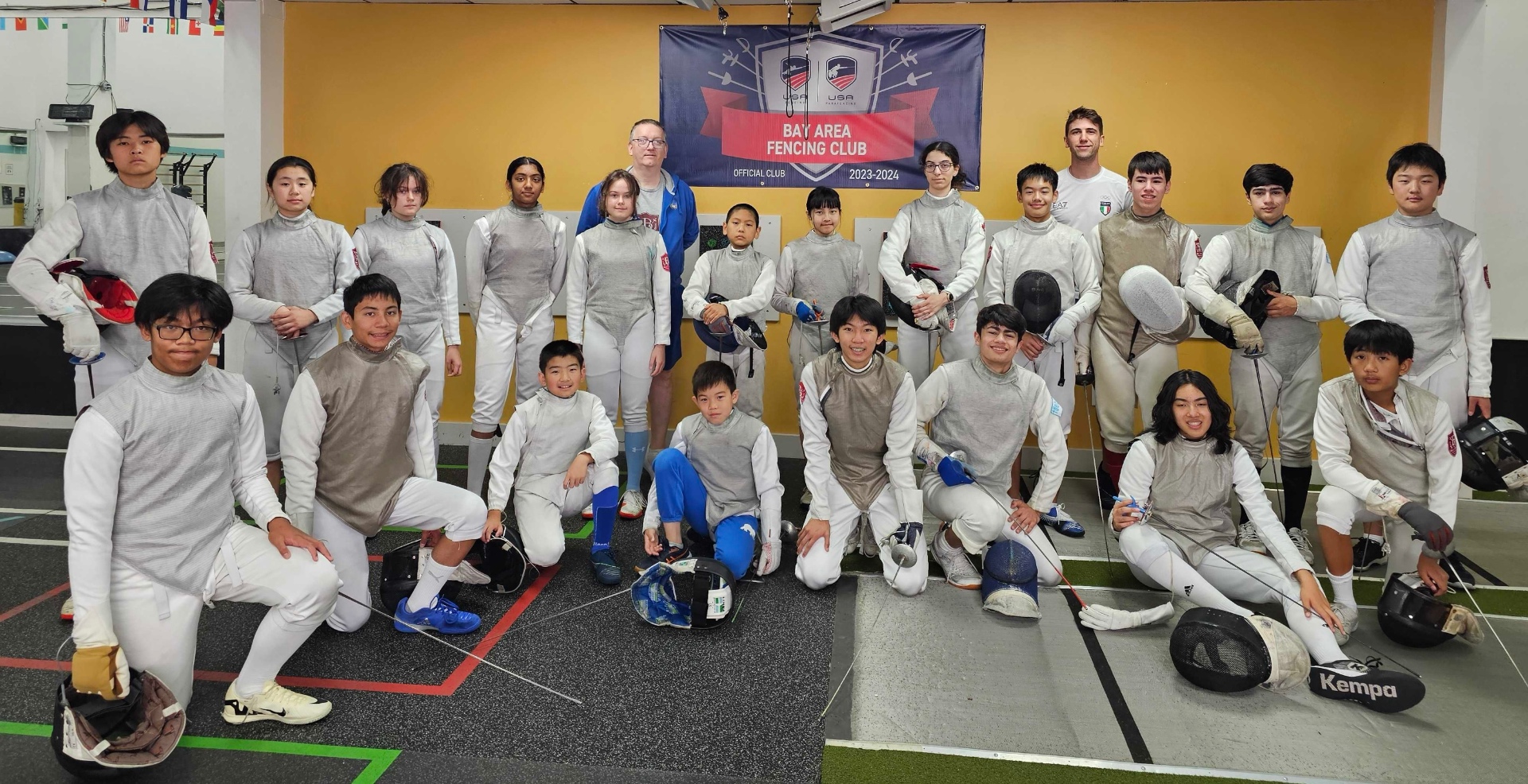 BAFC fencers and coaches group photo under the club banner