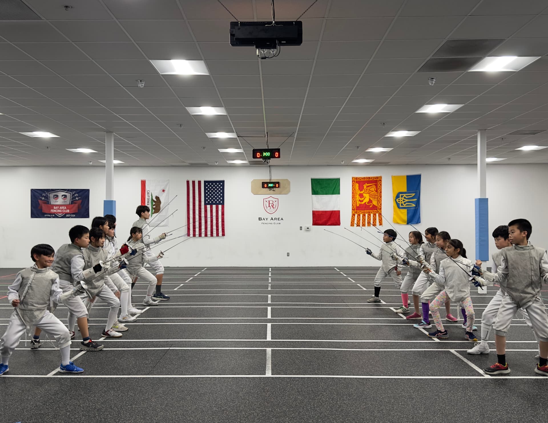 Young fencers training together at a Bay Area Fencing Club camp